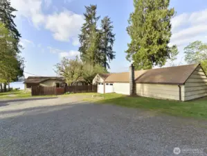 Head down the driveway toward the lake.  1200 sq ft shop on right, house in center
