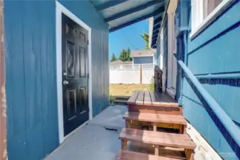 Covered walkway to the converted garage space