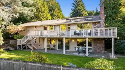 Expansive back deck and lower patio spaces overlook the private yard—perfect for outdoor entertaining and relaxed Northwest living.