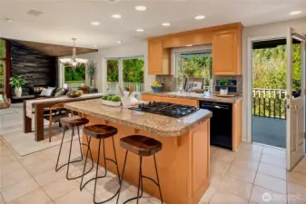 A bright, open kitchen that connects effortlessly to the living room and outdoor deck, creating the ultimate gathering space.