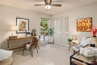 Versatile third bedroom or home office on the main level, ideal for working from home or creative pursuits.