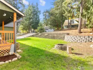 Unique front yard (offset from the road) with retaining walls, great for entertaining, gardening, or simply soaking in the peaceful PNW backdrop.