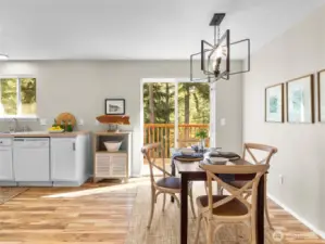 Dining area filled with natural light and backyard views, conveniently located off the kitchen.