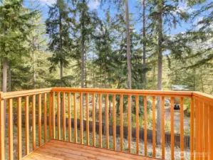 Enjoy peaceful moments on the back deck surrounded by trees and fresh air.