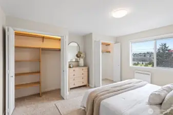 The bedroom can accommodate a king-sized bed, 2 closets with built-ins and a nook for a tv, chest of drawers or seating.