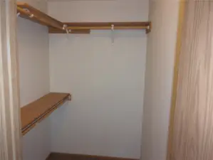 Walk-in closet in primary bedroom.