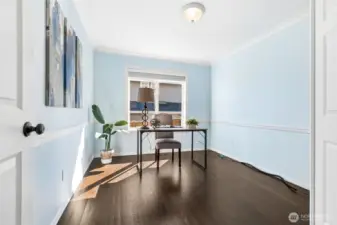 The architectural detail continues into the main floor office space -- perfect flex space to meet your needs!