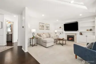 The owners repainted the wood built-in shelves flanking the fireplace and added the doors at the bottom for functionality as well as form.