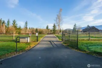 Private entry gate and paved driveway