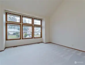 Large, wood wrapped windows fill the home with natural light.