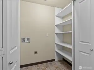 Laundry Closet on stair landing-where condos are attached