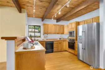The kitchen has plenty of room for your cooking needs.