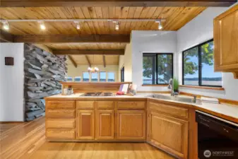 Showing the dining room location beyond the kitchen - standing bar area.