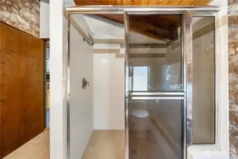 Large tiled shower in the primary bathroom.