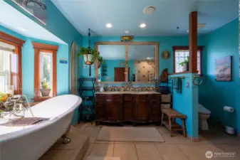 Luxurious bath retreat with soaking tub & timeless finishes.