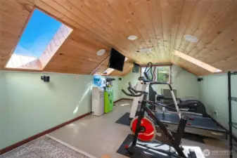 Upstairs bonus room offering flexible space for guests or family.