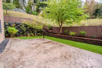 Backyard patio (rock wall view)