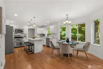 The kitchen has an eat in dining space and new quartz counters and all stainless steel appliances.
