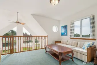 Loft upstairs with plenty of space to sit.