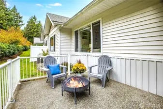 An extension of the home’s living space, this patio offers ample space for outdoor furniture, potted plants, an herb garden, or a small firepit.