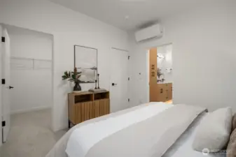 Primary Suite with walk-in closet and en-suite bathroom.