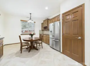 Causal ding area in kitchen.  Oversized tiled flooring.  Newer stainless appliances.   Upgraded solid wood doors and window sill throughout the home.