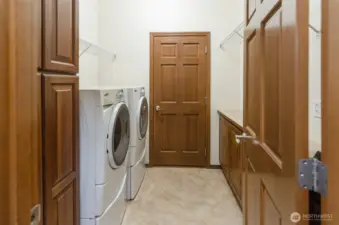 Utility room is the perfect example of best use of space and providing loads of additional storage.  Washer and dryer stay with the home.