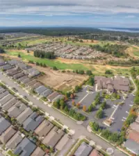View of the community lodge from the air, showing the golf course.
