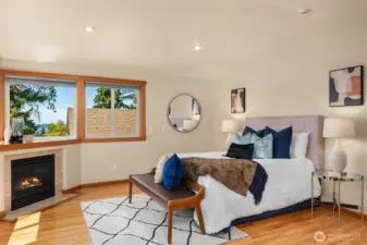 Primary bedroom with a view and sitting room space