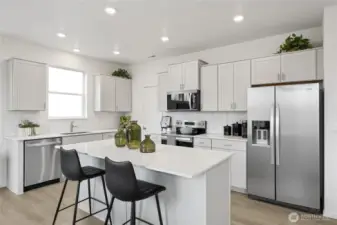 Kitchen with quartz countertops, full height backsplash, and soft close cabinets.  Pictures are for representational purposes only, colors and features may vary.