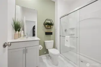 Downstairs 3/4 bathroom features a walk-in shower.  Pictures are for representational purposes only, colors and features may vary.