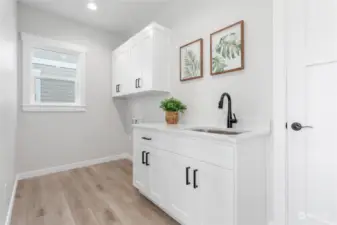 Nice utility room with extra storage.