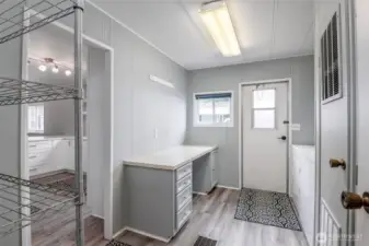 Laundry room with desk