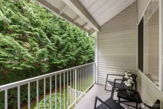 Relax on the private back deck off family room with  seclusion of the surrounding nature