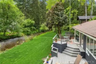 Expansive, tiered deck with hot tub and space to host a crowd in style.