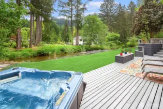 Hot tub + layered deck = the ultimate outdoor relaxation zone.