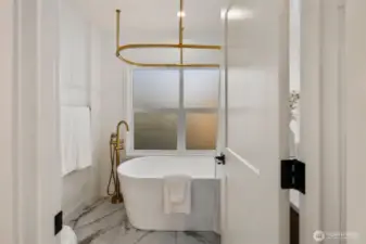 2nd Floor full bath with standalone Soaking tub/shower combo.