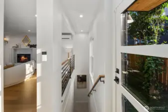 Staircase leading down to the lower area (Basement) with a 2nd living Room, 2 bedrooms, 1 full bath, & Laundry Room.