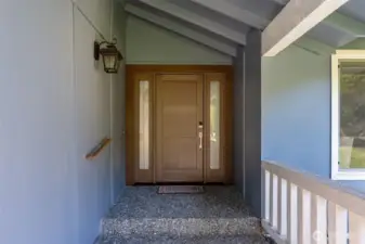 Just one stair to main entrance with oversized front door.