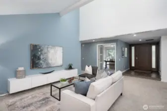 Living room has built-in cabinets for extra storage.