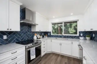 Lots of counter space and stainless steel appliances makes this kitchen a chef's delight.