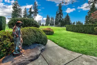 A front-row vantage onto Sand Point Country Club’s meticulously maintained fairways, framed by sculpted yew hedges and mature evergreens that reinforce both privacy and expansiveness. Life on the course places you steps from the Club’s wide range of amenities: an 18-hole championship golf course, practice facilities, tennis and pickleball courts, a junior-friendly swim program, a full clubhouse with dining and social events, and year-round recreational programming. This outlook captures not only the beauty of the grounds but the daily convenience of club life woven seamlessly into the landscape.