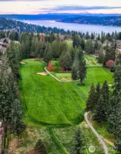 Positioned along the 4th Green of Sand Point Country Club, the property sits within the club’s wide, park-like landscape with open sightlines extending toward Lake Washington. This image underscores the home’s direct relationship to the fairway and its close access to SPCC amenities, trails, and community spaces.