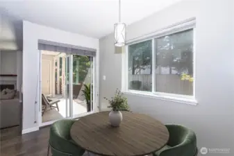 Bright dining area with sliding doors leading outside.