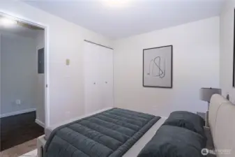 Alternate view of the Secondary bedroom showing closet access and natural light.