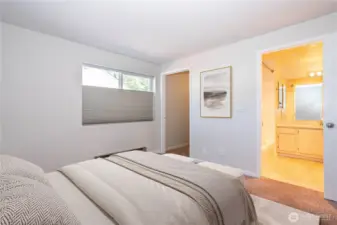 Bedroom looking toward ensuite bathroom and closet, offering great natural flow.