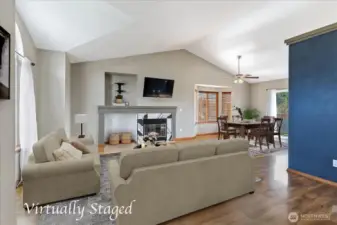 Another view of the spacious living room with dining room beyond.