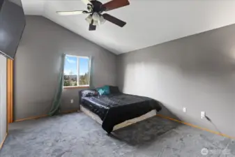 Primary suite offers new carpet, vaulted ceilings and walk-in closet.