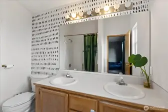 Primary en-suite with dual vanity.