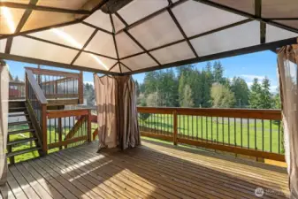 Lower deck overlooking back yard  & park with gazebo.